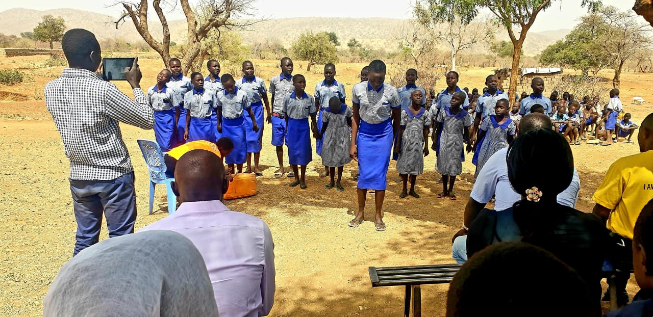 ATC volunteers supporting students during a community visit